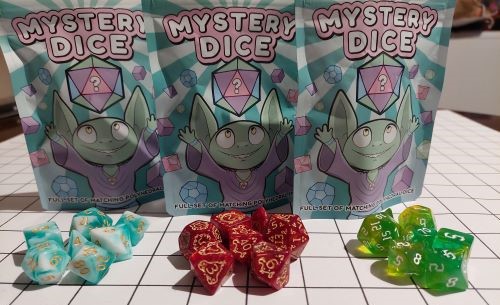Mystery Dice Goblin 3 sets of dice, green and white, red with cool gold swirls and green and yellow sparkly
